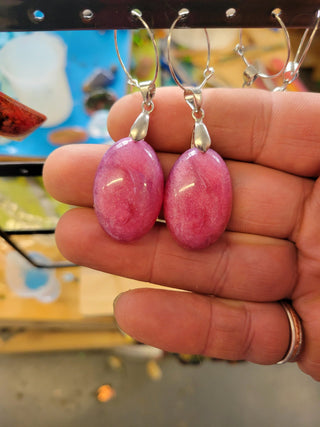 Handmade pink shimmery resin earrings with secure clasps—lightweight, glittery, and unique. Perfect for gifting or adding everyday shimmer