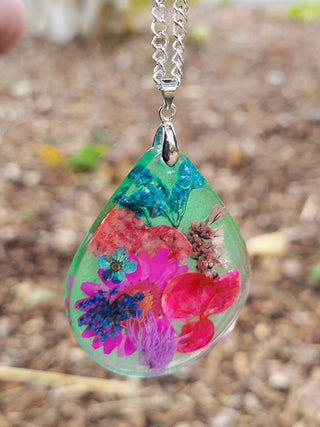floral resin necklaces featuring a selection of real dried flowers encapsulated in high quality resin with silver plated chain.