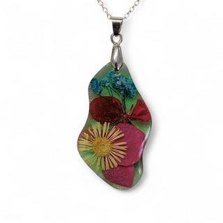 floral resin necklaces featuring a selection of real dried flowers encapsulated in high quality resin with silver plated chain.