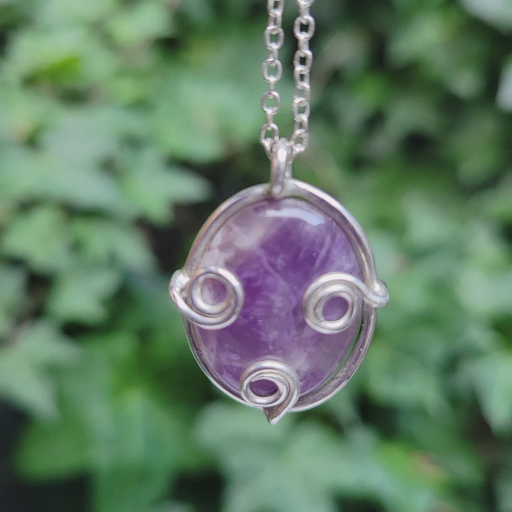 amethyst with scroll setting