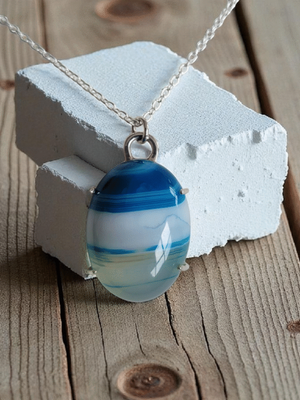 Blue polished stripe agate stone set in a 4 claw sterling silver setting